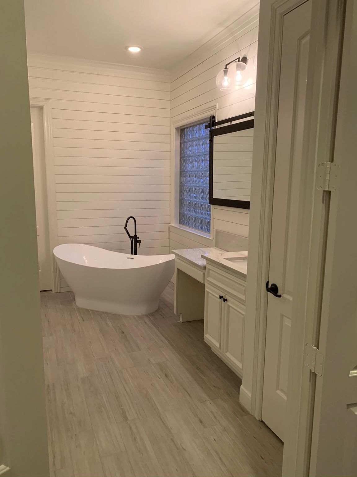 Completed bathroom renovation with freestanding tub